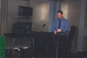 a man standing in front of a microphone