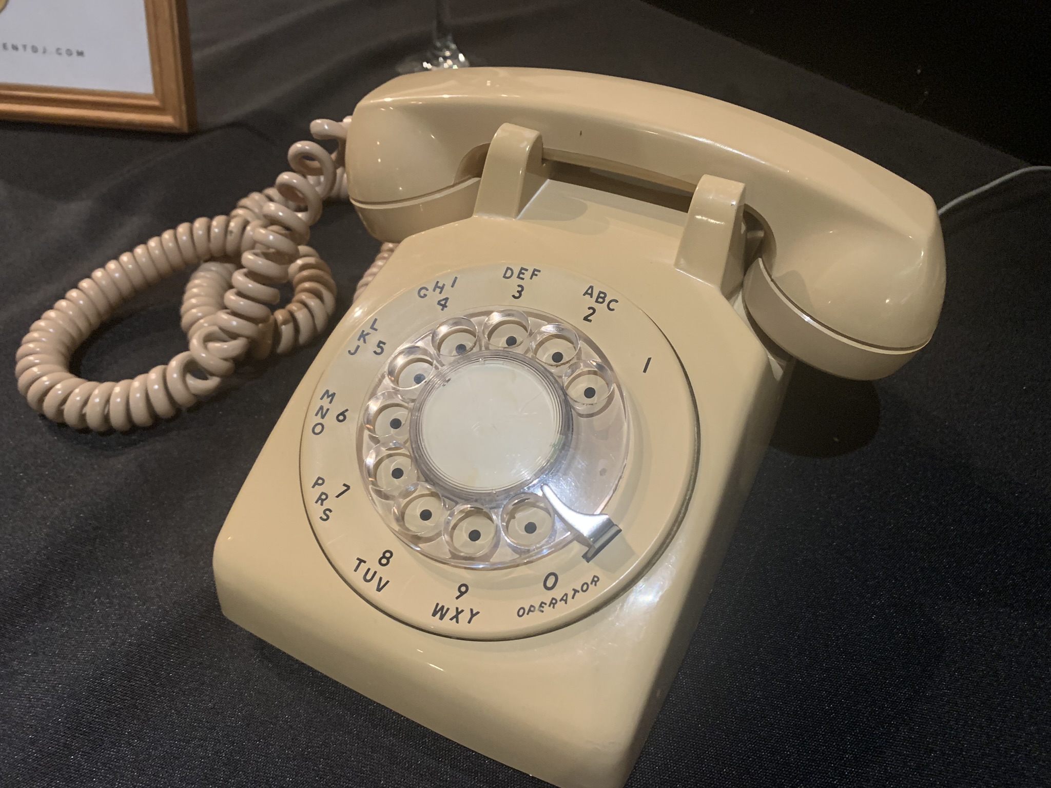 an old style telephone sitting on top of a table