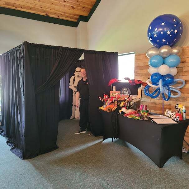 a party room with balloons and decorations